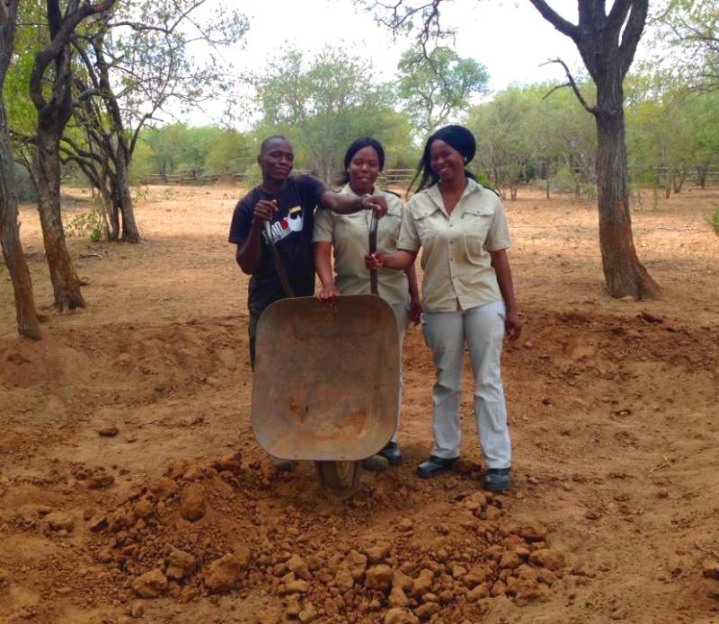 Black Mambas helping to dig mud pit for rhinos